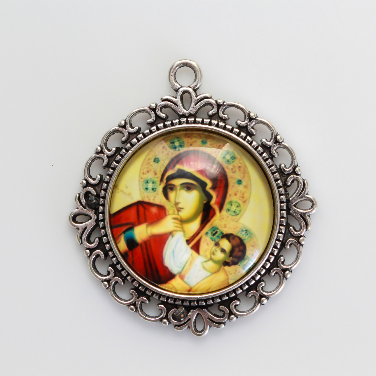 25mm Round glass cabochon depicting the Virgin Mary with child Jesus. These will fit cabochon settings with a 25mm tray