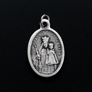 Our Lady of Consolation medal that depicts Our Lady on the front and the Shrine of Our Lady of Consolation in Carey, Ohio on the backside