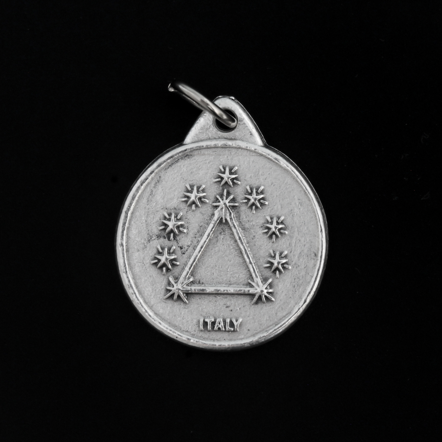 The front of the medal features an embossed image from the reported apparitions of Maria del Rosario de San Nicolas, Argentina.