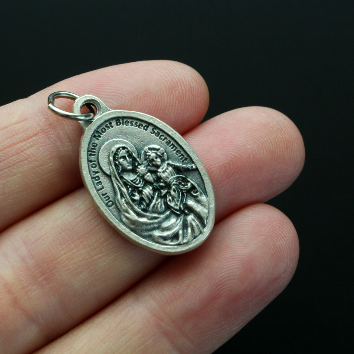 Saint Peter Julian Eymard medal that depicts the saint on the front and Our Lady of the Most Blessed Sacrament on the back