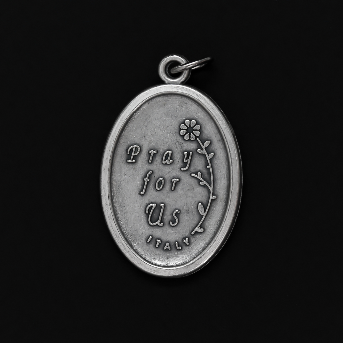 Saint Lucy medal that depicts the saint on the front and "Pray For Us" on the back