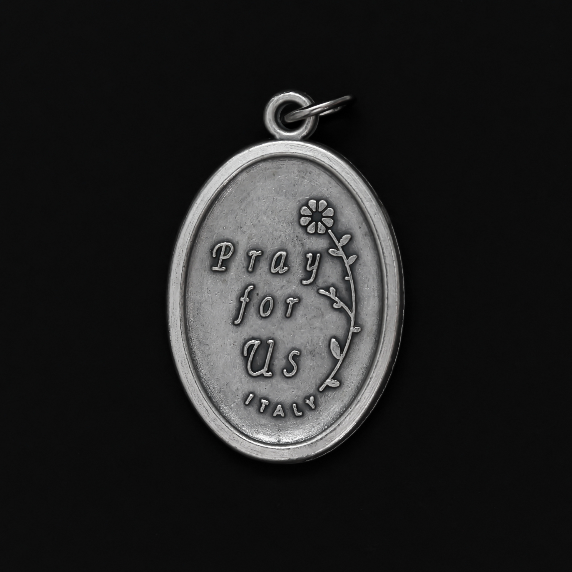 Saint Lucy medal that depicts the saint on the front and "Pray For Us" on the back