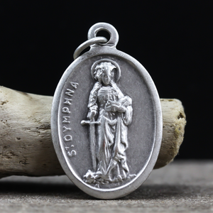 die cast silver medal depicting patron saint dymphna