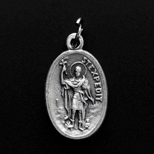 Saint Expidito medal. The back is marked "Ruega Por Nosotros" Spanish for pray for us