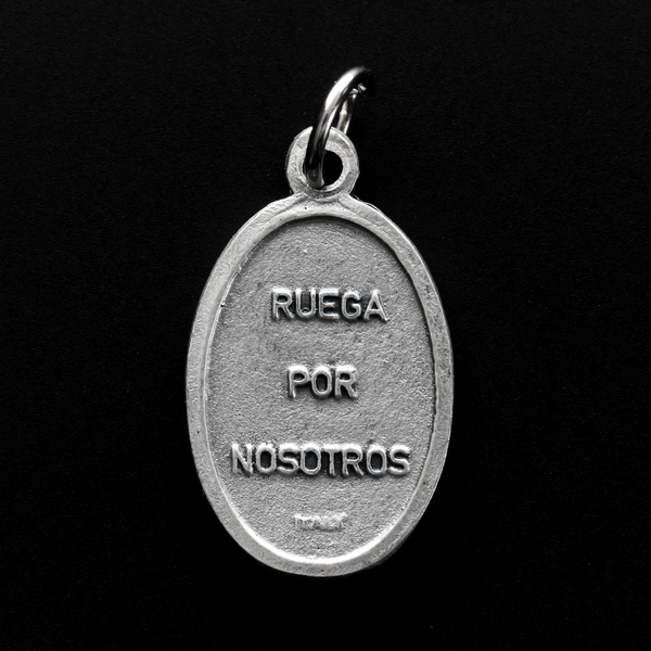 Saint Expidito medal. The back is marked "Ruega Por Nosotros" Spanish for pray for us