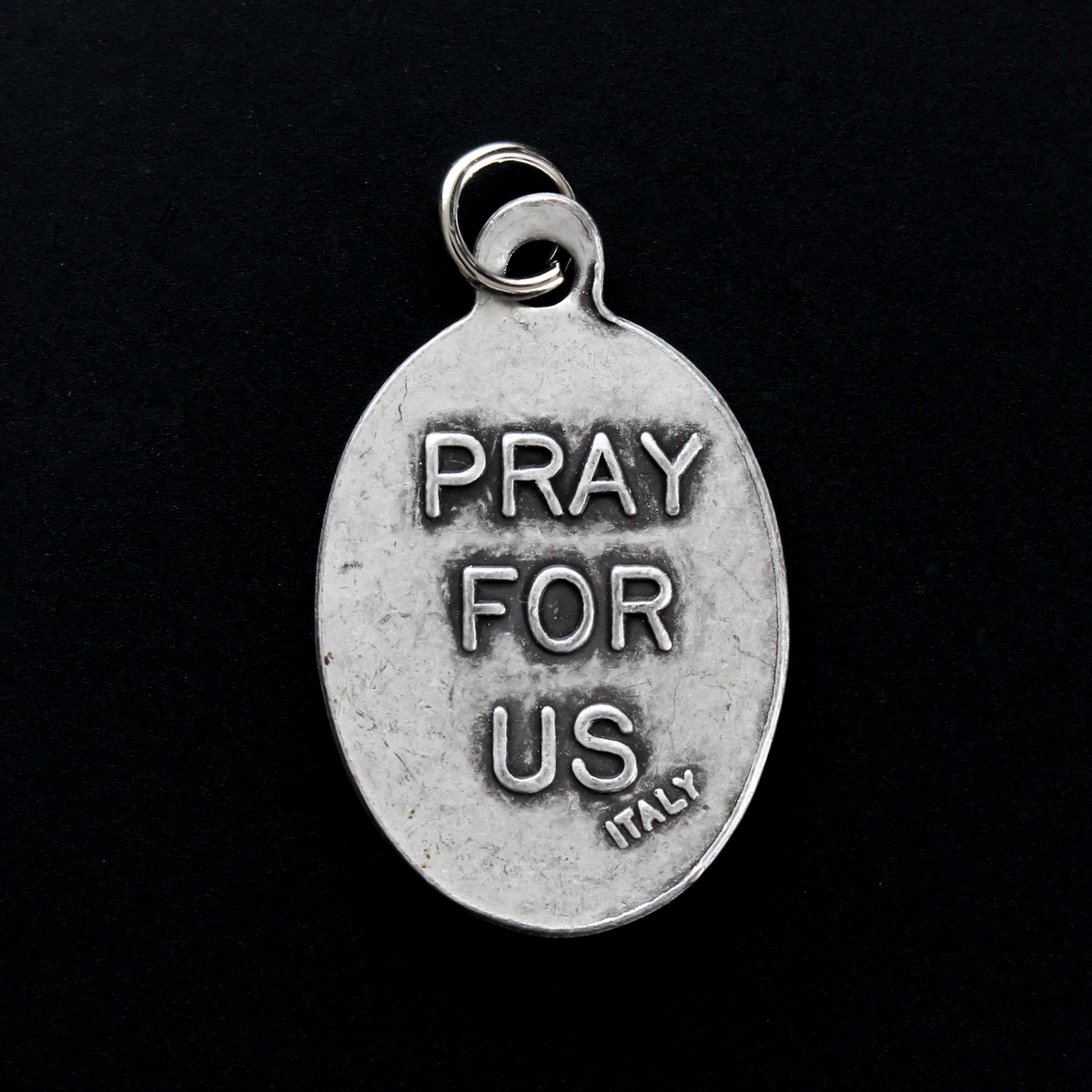 Saint Junípero Serra medal that depicts the saint on the front and "Pray For Us" on the back.