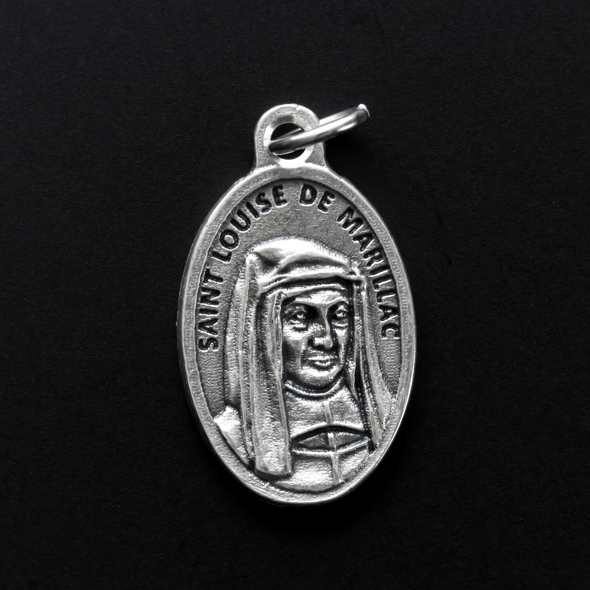 Saint Louise de Marillac medal that depicts the saint on the front and is marked "Pray For Us" on the back.