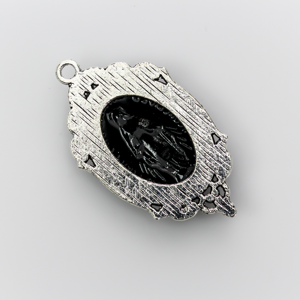 Ornate oval antiqued silver style cabochon setting with an open back
