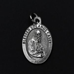 Blessed Solanus Casey medal that depicts the saint on the front and "Pray For Us" on the back