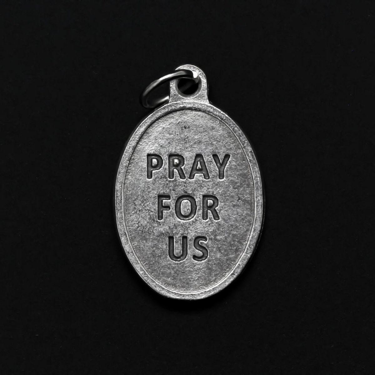 Blessed Solanus Casey medal that depicts the saint on the front and "Pray For Us" on the back