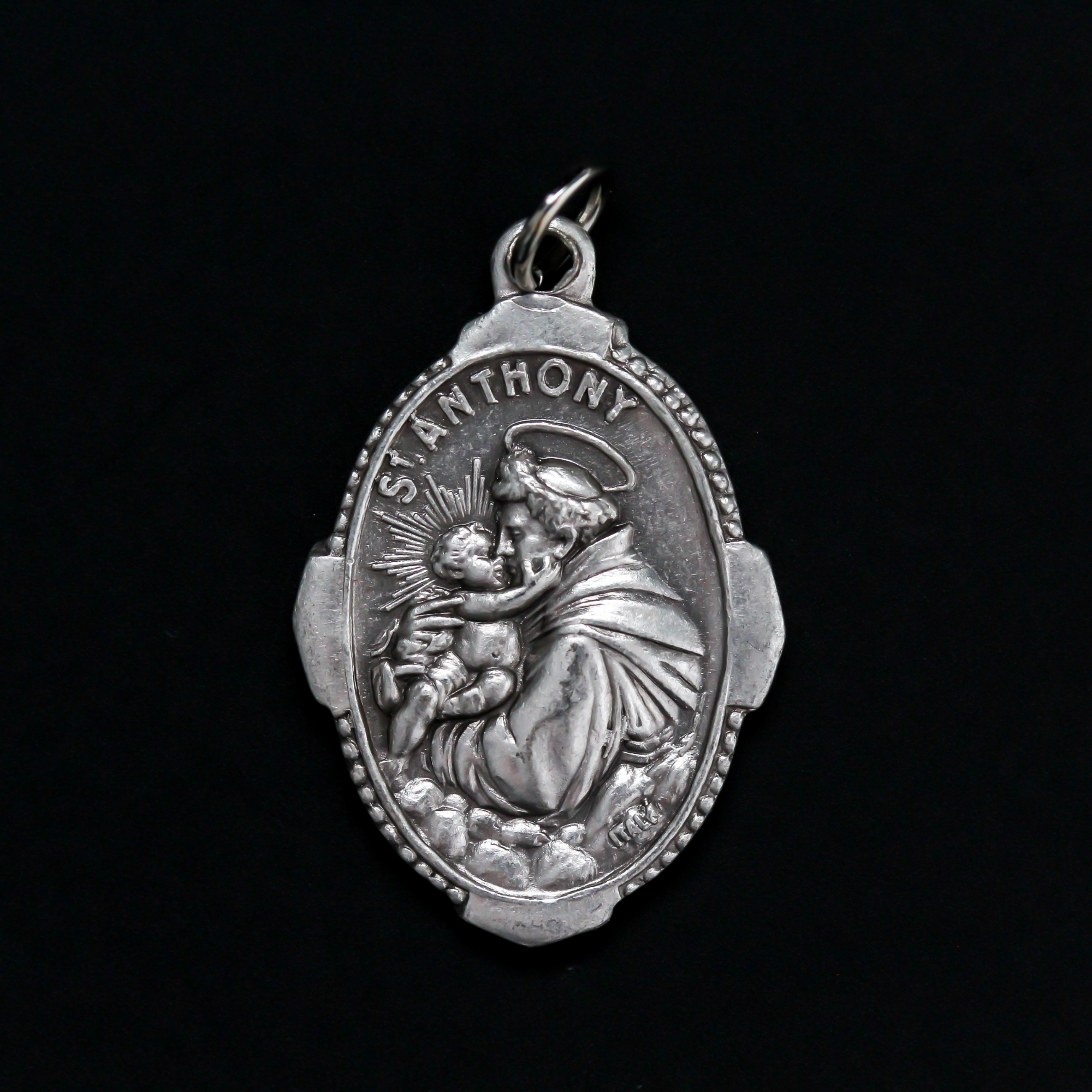 Saint Anthony of Padua deluxe ornate medal that depicts St. Anthony holding infant Jesus on the front and "Pray For Us" on the back