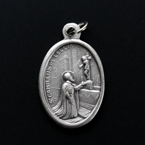 Saint Camillus de Lellis 1" oval medal that depicts the saint on the front and the reverse side is marked "Pray For Us"