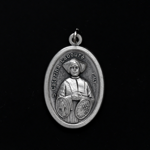 Saint Catherine Labouré medal that depicts the saint on the front with the Miraculous Medal and the reverse is marked "Pray For Us