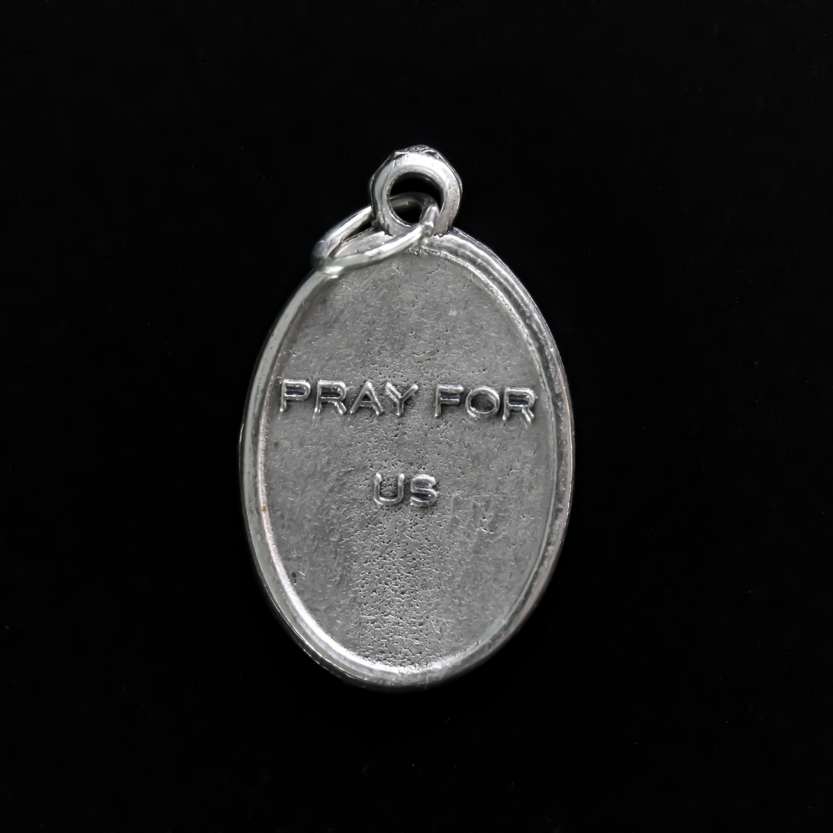Saint Ignatius of Antioch medal that depicts the saint before a book and cross on the front and "Pray For Us" on the back