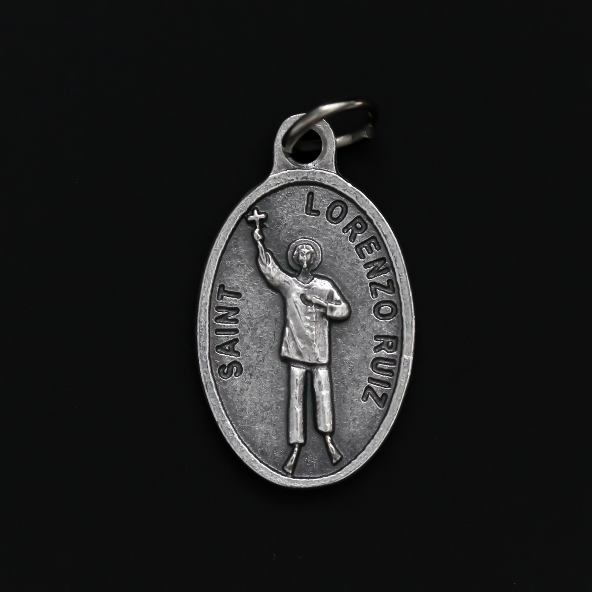Saint Lorenzo Ruiz medal that depicts the saint on the front and is marked "Pray For Us" on the back