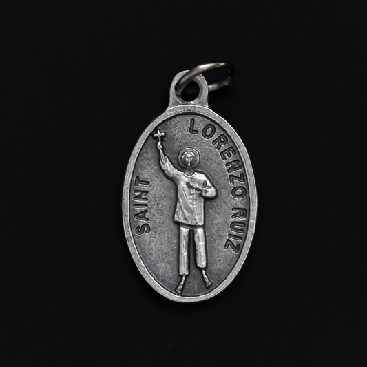 Saint Lorenzo Ruiz medal that depicts the saint on the front and is marked "Pray For Us" on the back