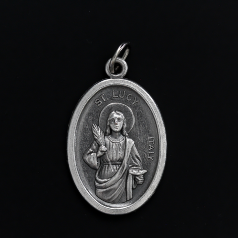 Saint Lucy medal that depicts the saint on the front and "Pray For Us" on the back