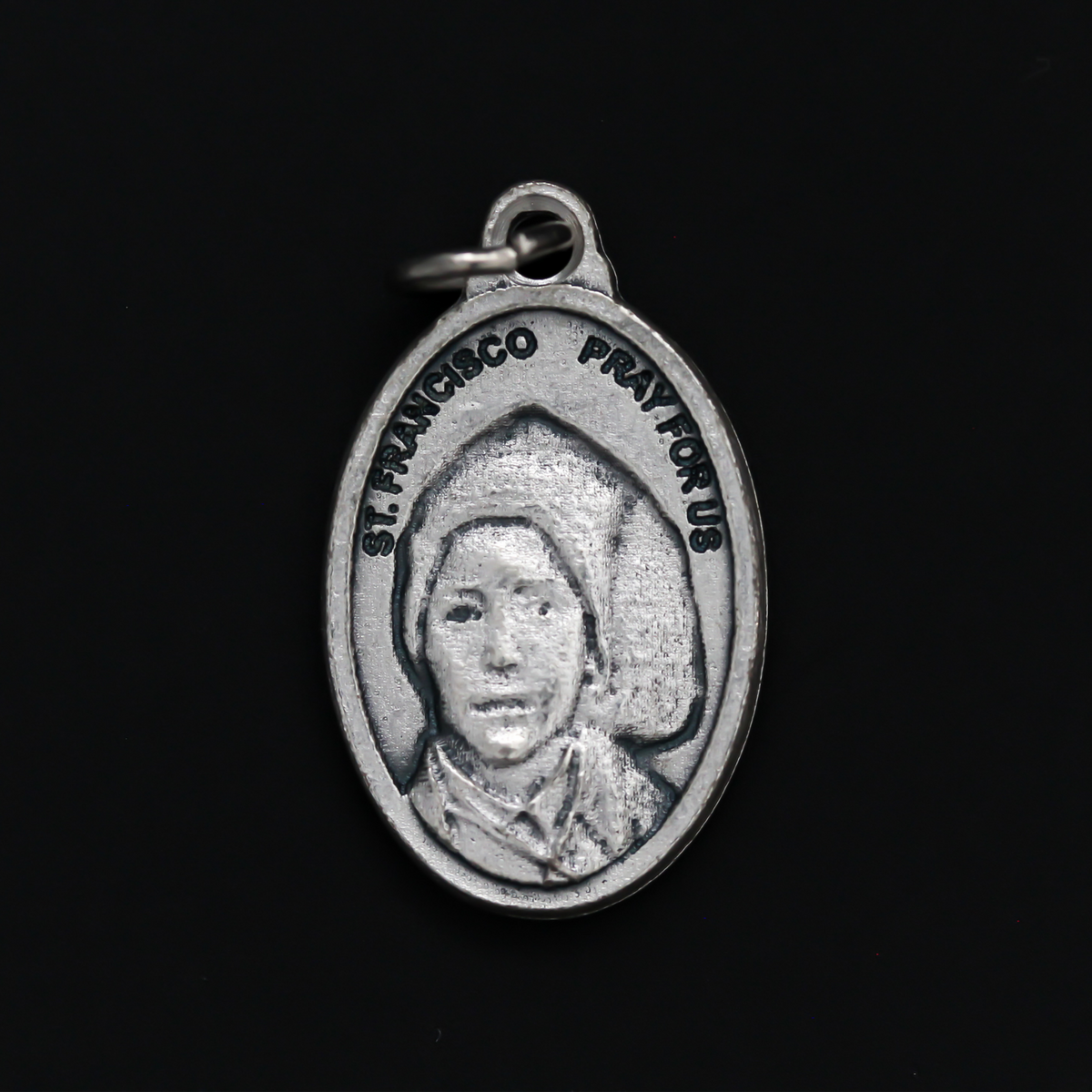 Saints Jacinta and Francisco Marto medal that depicts each saint on one side. Made in Italy.