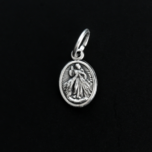 Tiny Divine Mercy of Jesus medal with Our Lady of Guadalupe on the backside