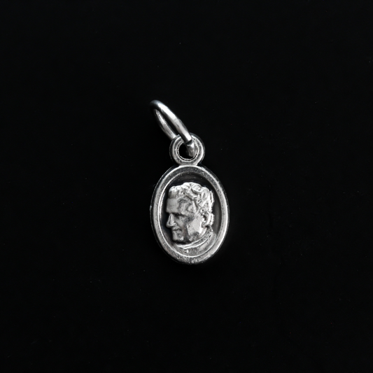 Saint Giovanni "Don" Bosco mini medal that depicts St. Don Bosco on the front and Mary, Help of Christians, on the back