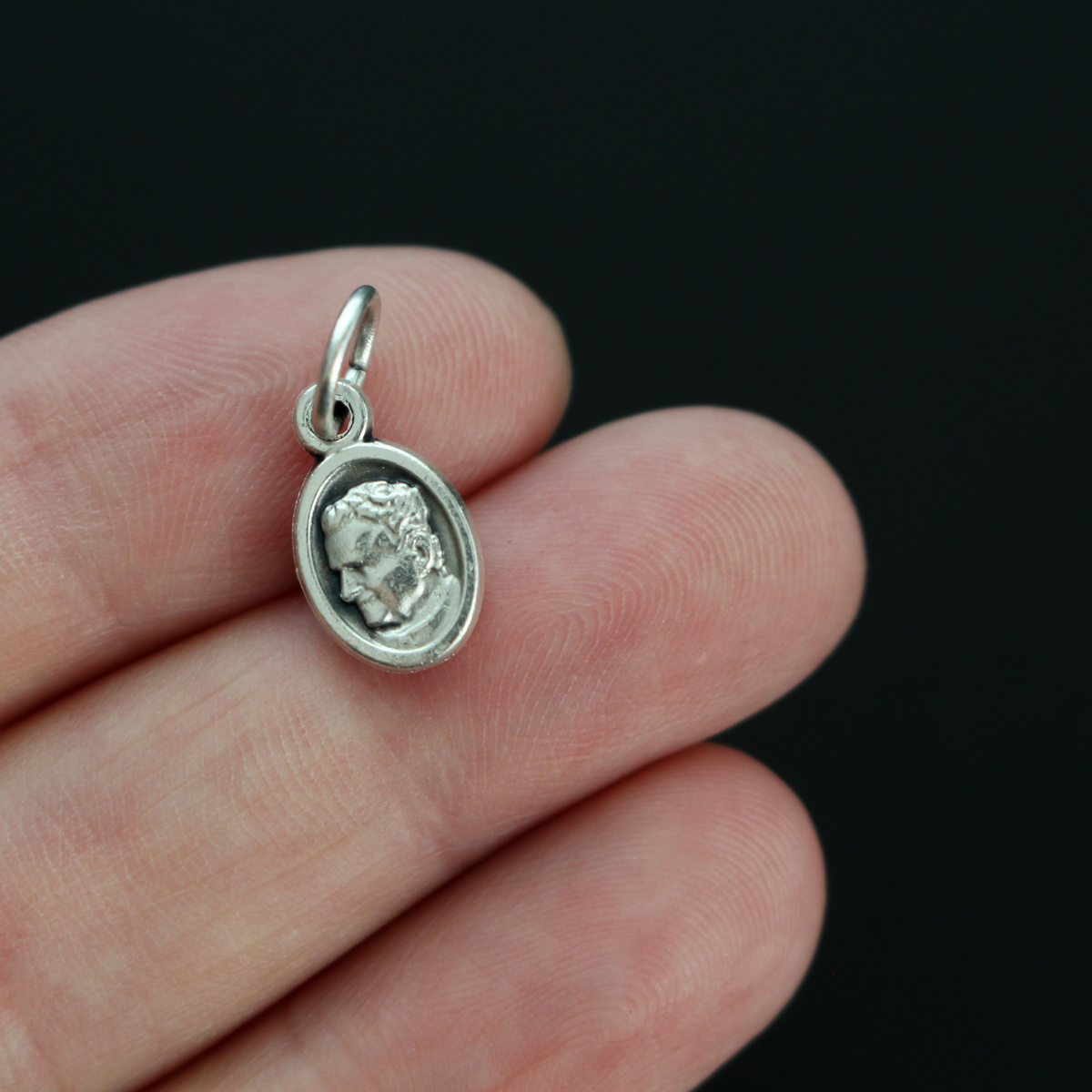 Saint Giovanni "Don" Bosco mini medal that depicts St. Don Bosco on the front and Mary, Help of Christians, on the back