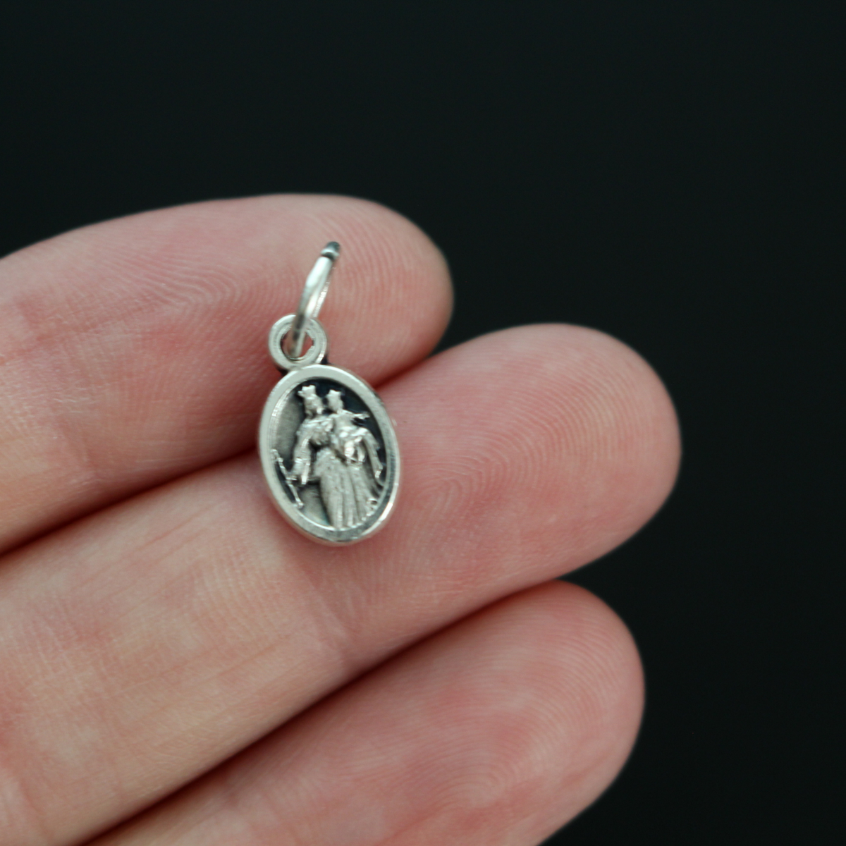 Saint Giovanni "Don" Bosco mini medal that depicts St. Don Bosco on the front and Mary, Help of Christians, on the back