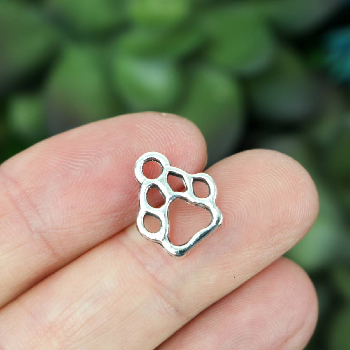 silver tone paw print charm cutout design