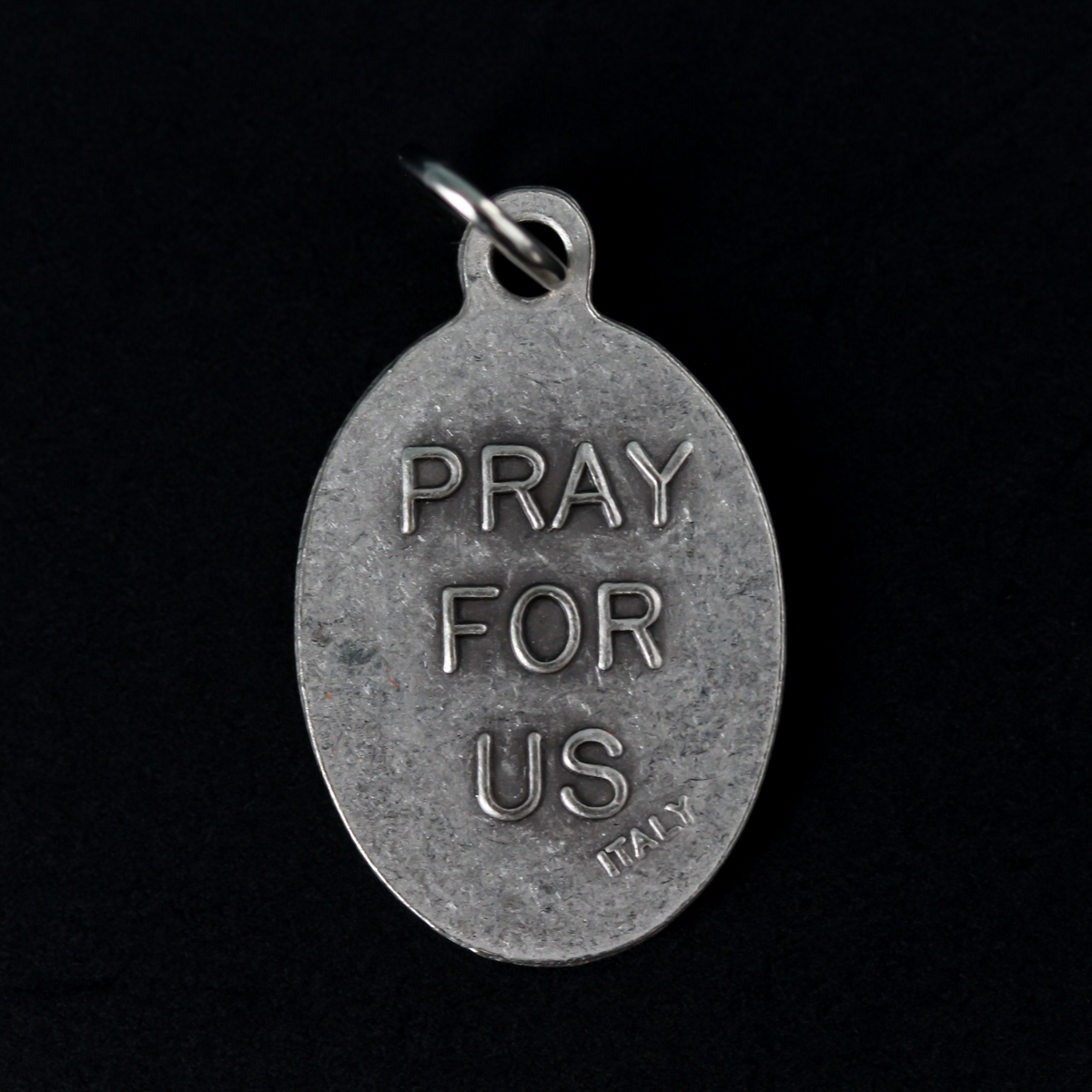 Annunciation of Our Lady medal that depicts the Blessed Virgin Mary with Archangel Gabriel on the front and is marked "Pray For Us" on the back