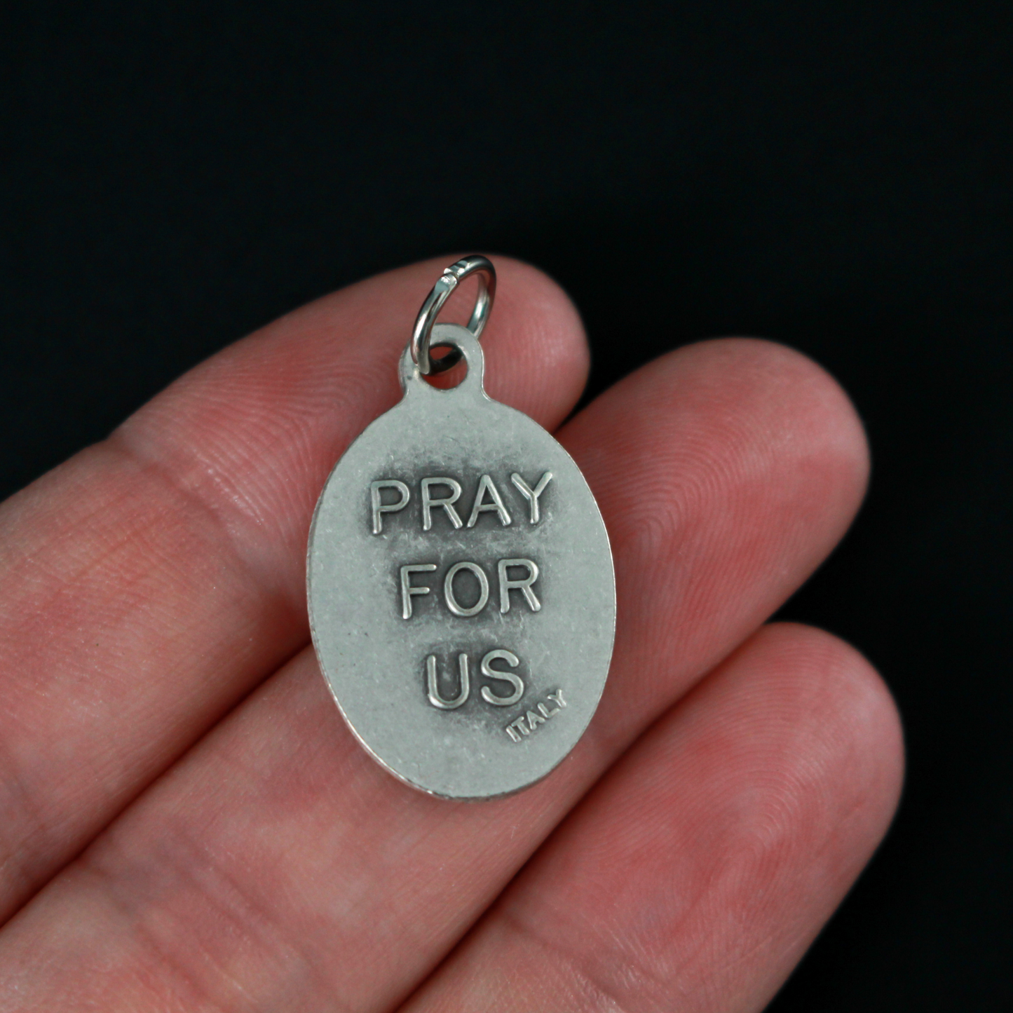 Annunciation of Our Lady medal that depicts the Blessed Virgin Mary with Archangel Gabriel on the front and is marked "Pray For Us" on the back