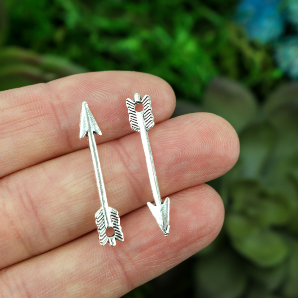silver tone arrow shaped jewelry charm
