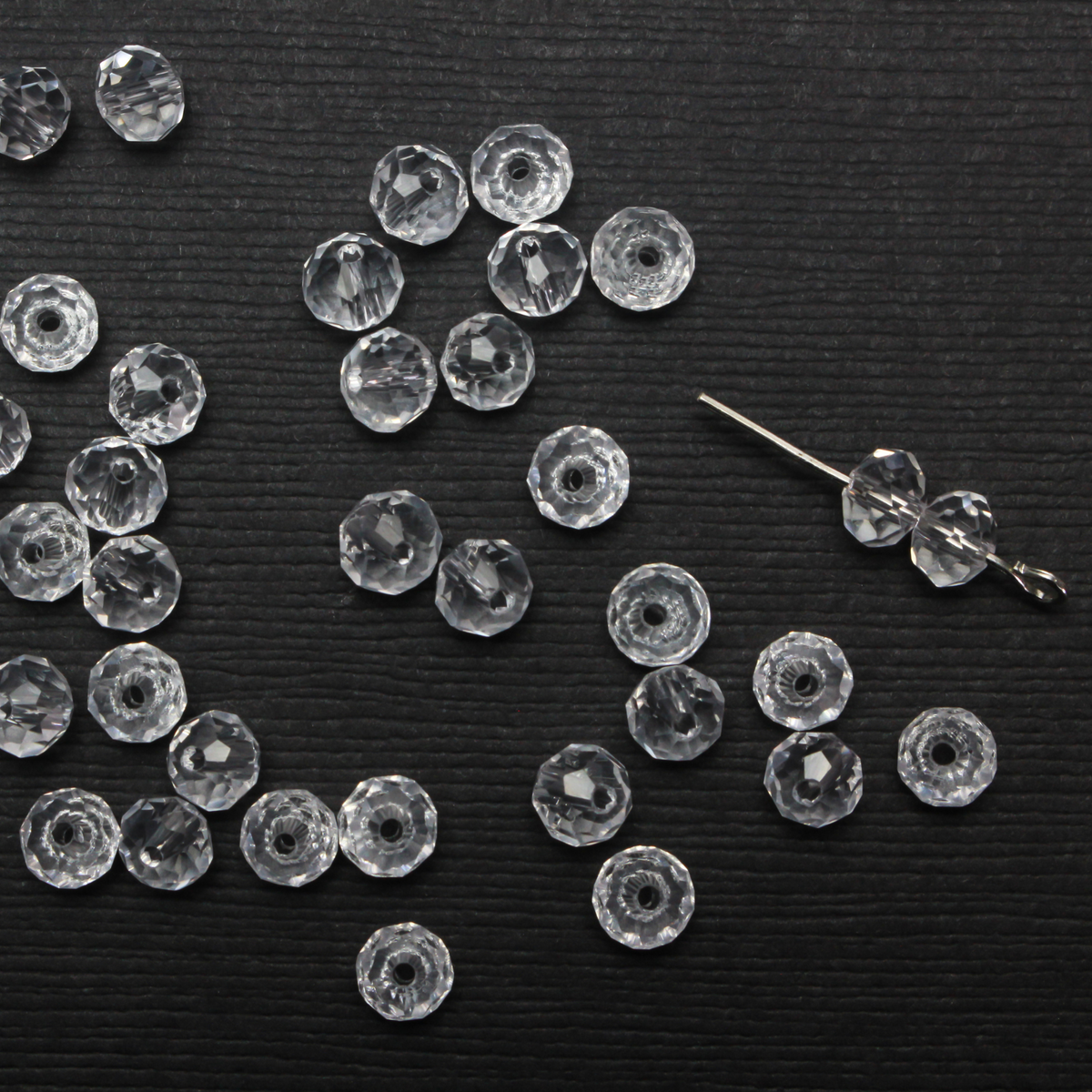 Asian cut crystal glass beads. Clear 6mm round faceted transparent. Sold in packages of 60 beads