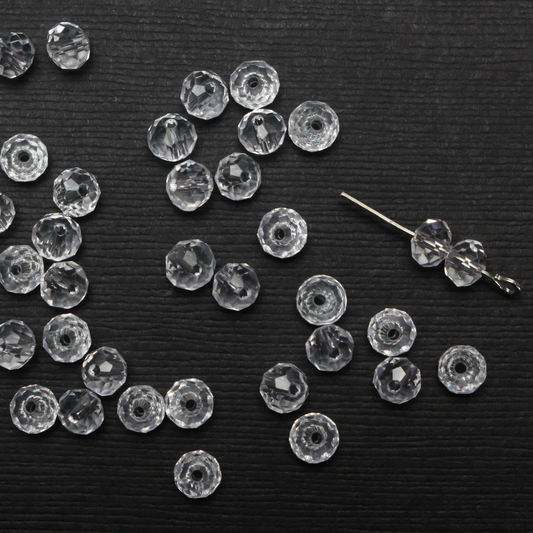 Asian cut crystal glass beads. Clear 6mm round faceted transparent. Sold in packages of 60 beads