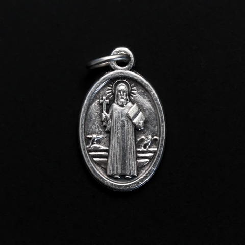 St. Benedict protection medal that depicts the saint on the front. This medal is slightly smaller than our one inch version, it measures 7/8" from the top of the bale to the bottom of the medal