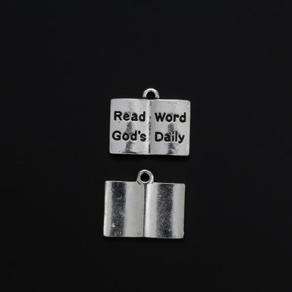 Open book charm with the words "Read God's Word Daily" in black lettering on the open pages