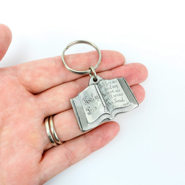 vintage keychain shaped like a bible with a quote