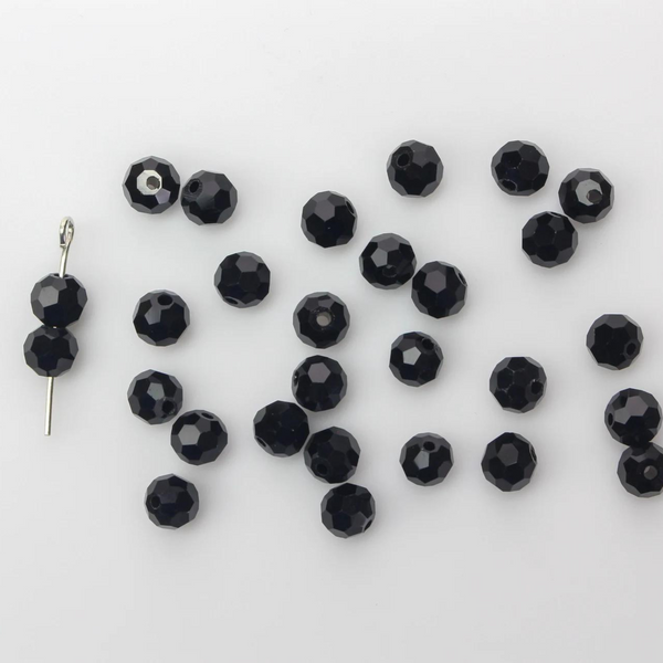 Asian cut crystal glass beads. Black 6mm x 4.4mm faceted. Sold in packages of 60 beads