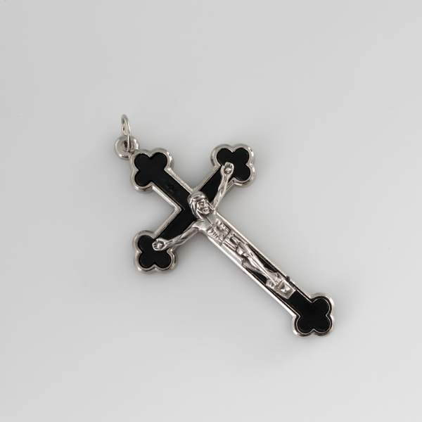 Budded black inlay cloverleaf crucifix with silver corpus and trim, 2.5 inches long