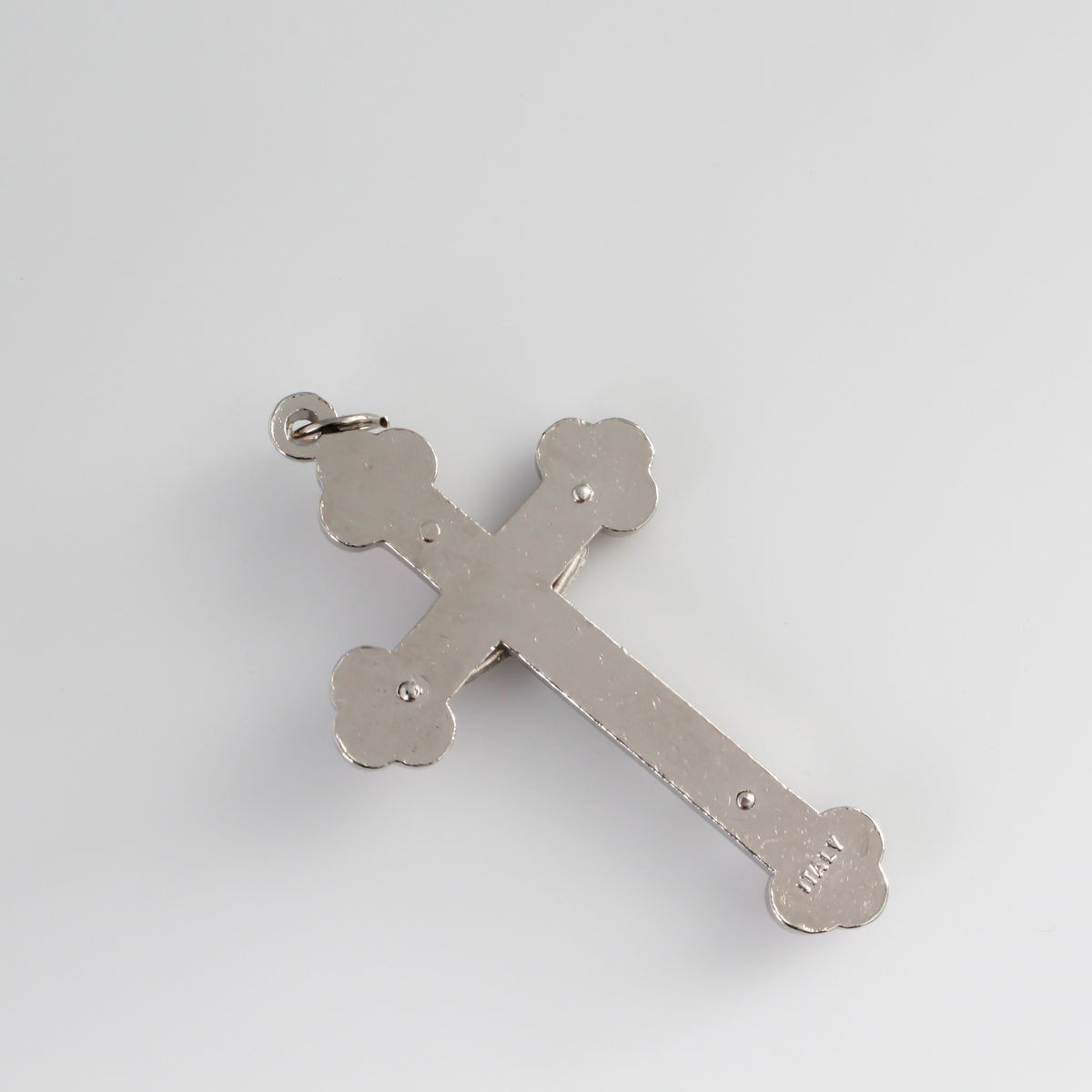 Budded black inlay cloverleaf crucifix with silver corpus and trim, 2.5 inches long