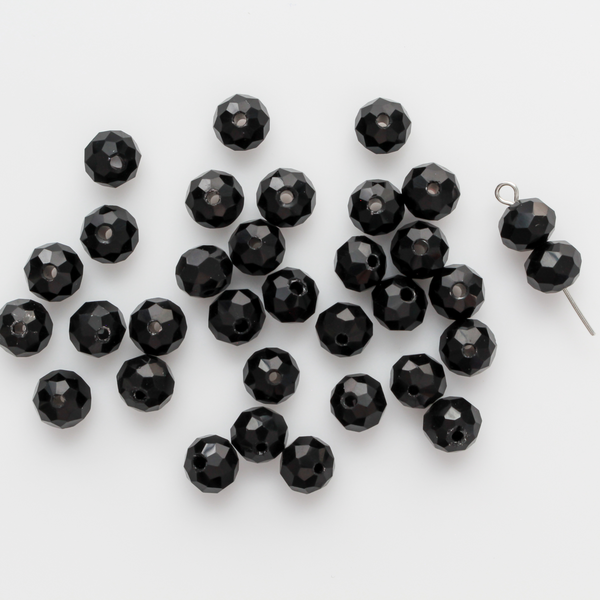 Asian cut crystal glass beads. Black 8mm x 6.2mm rondelle faceted. Sold in packages of 60 beads