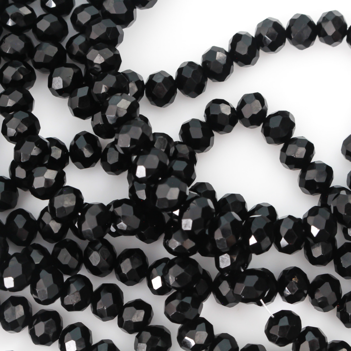 Opaque glass faceted rondelle beads that are solid black in color, 8x6mm