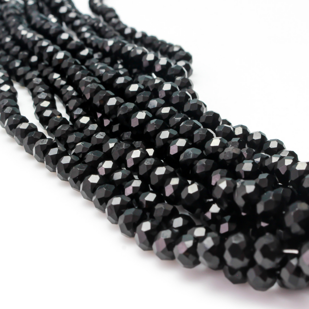 Opaque glass faceted rondelle beads that are solid black in color, 8x6mm