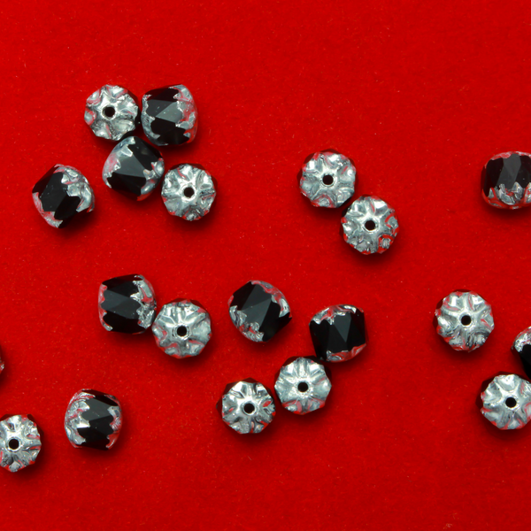 Cathedral shape beads that are faceted. The top and the bottom of the bead are a patterned glass with a silver coating. Made in the Czech Republic. Sold in sets of 20 beads.