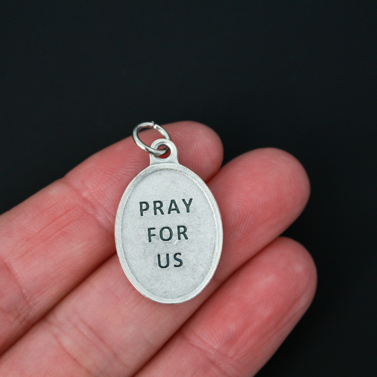 Blessed Stanley Rother medal that depicts the priest on the front and is marked "Pray for us" on the back.