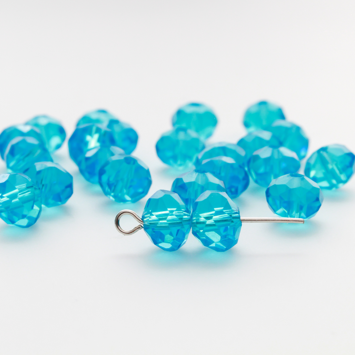 Asian cut crystal glass beads. 8mm x 6.2mm rondelle faceted dark blue transparent. Sold in packages of 60 beads
