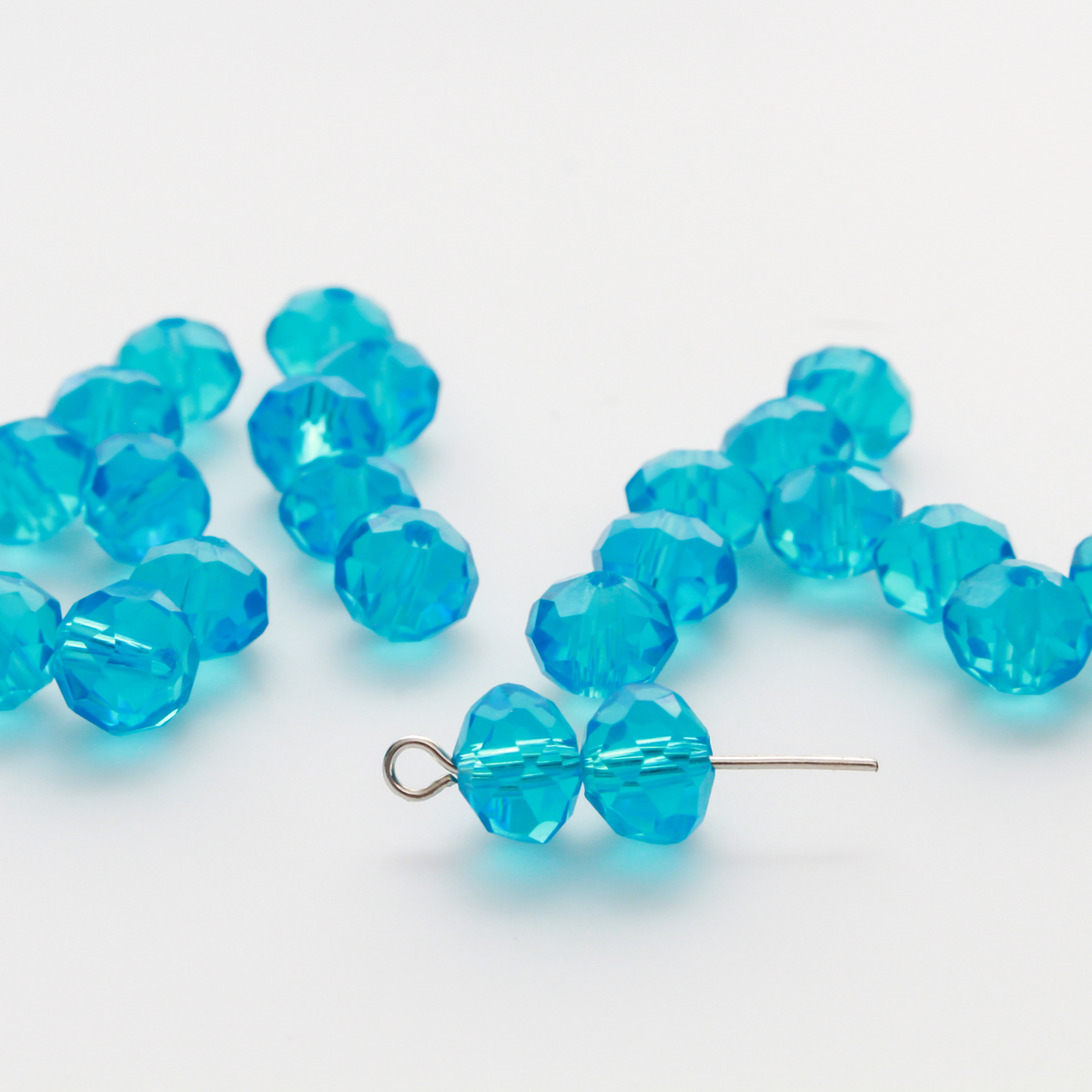 Asian cut crystal glass beads. 8mm x 6.2mm rondelle faceted dark blue transparent. Sold in packages of 60 beads