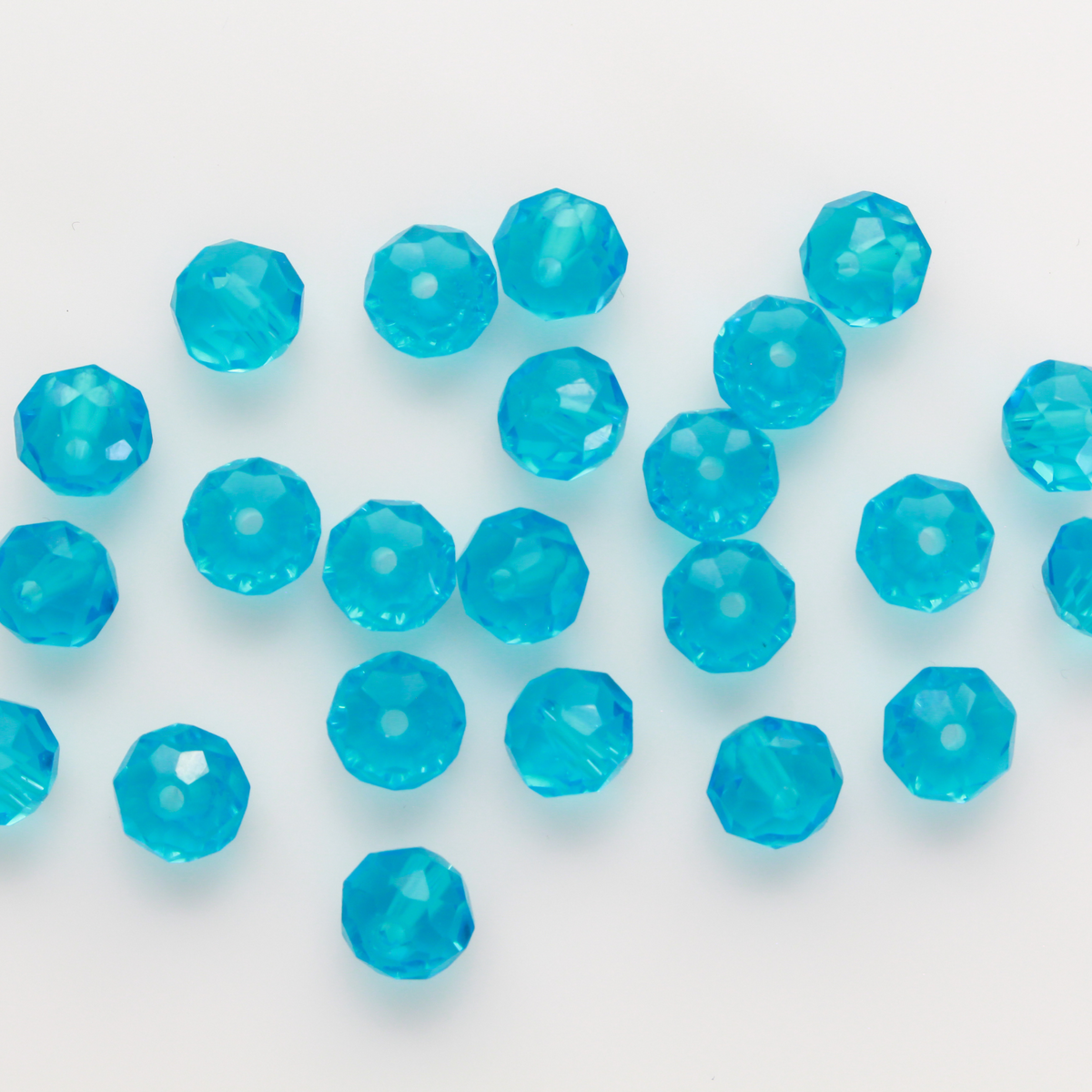 Asian cut crystal glass beads. 8mm x 6.2mm rondelle faceted dark blue transparent. Sold in packages of 60 beads