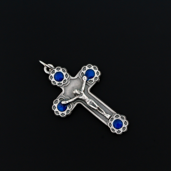 Crucifix cross with blue enamel flowers at the ends. This beautifully detailed cross is handmade in Italy and is 1-11/16" long