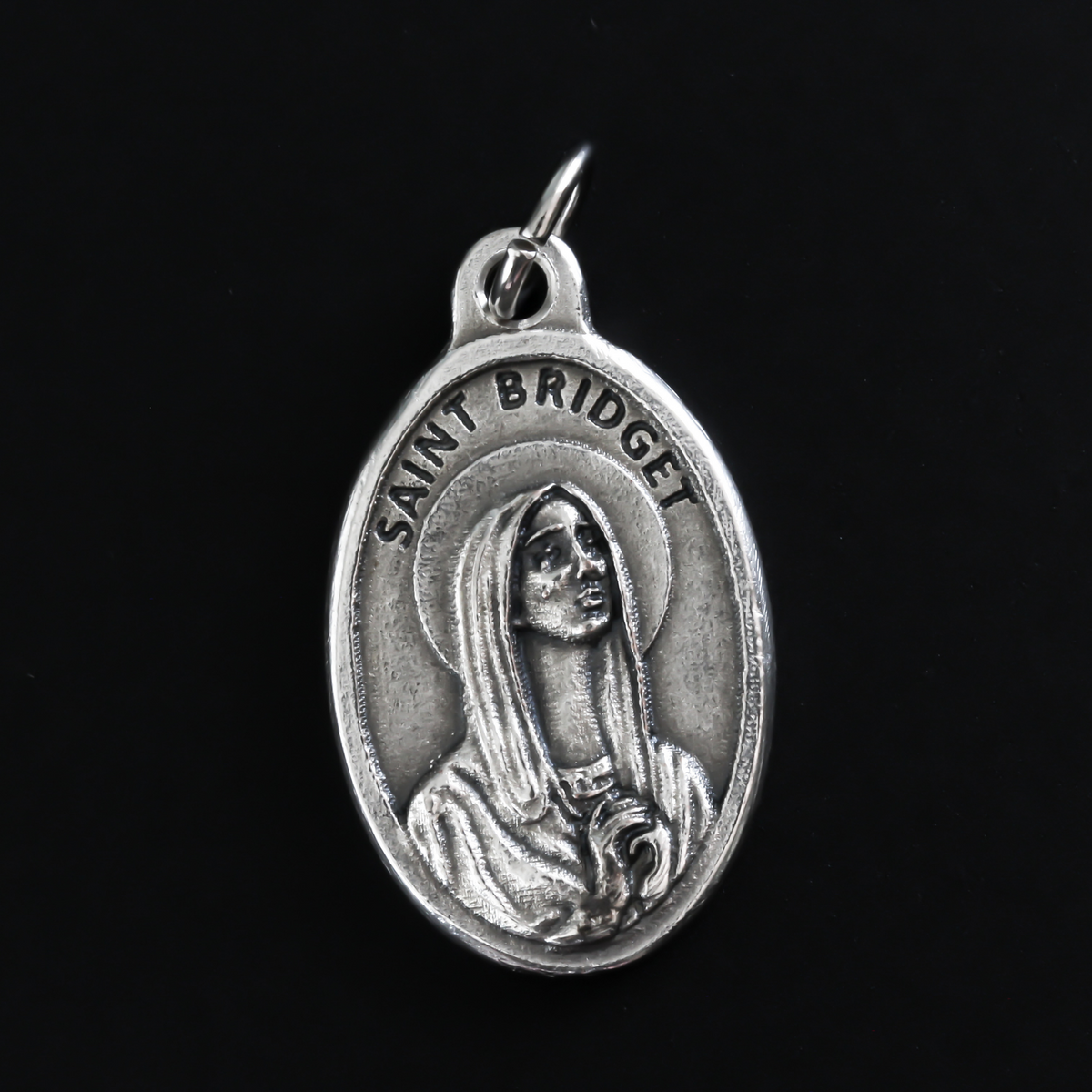 Saint Bridget of Sweden medal that depicts the saint on the front and is marked "Pray For Us" on the back.