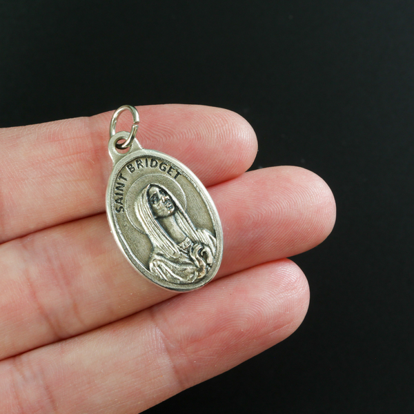Saint Bridget of Sweden medal that depicts the saint on the front and is marked "Pray For Us" on the back.