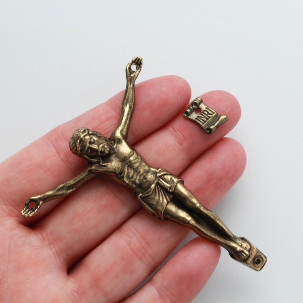 A beautifully detailed bronze corpus that comes with an INRI scroll sign